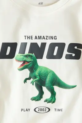 T-shirt imprimé en coton - Crème/dinosaure