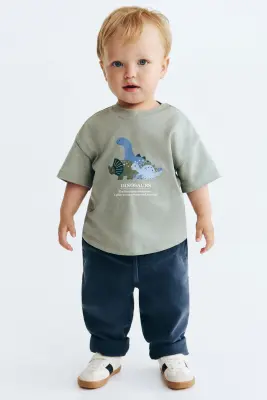 T-shirt imprimé en coton - Vert kaki clair/dinosaures