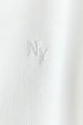 Polo en piqué avec motif brodé - Blanc