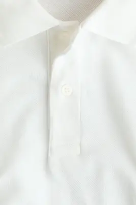 Polo en piqué avec motif brodé - Blanc