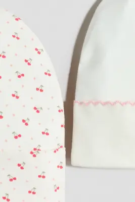 Lot de 2 bonnets en coton - Blanc/cerises