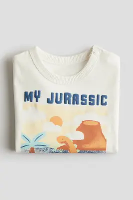 T-shirt imprimé en coton - Crème/dinosaures